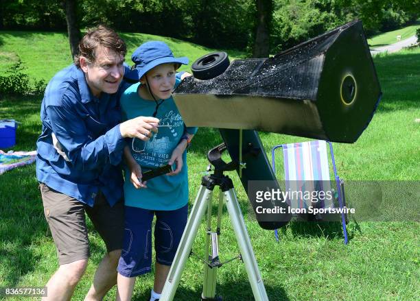 Spectator looks through a special telescope during a total eclipse of the sun on August 21 as viewed from the Cohen Recreation Center in Chester, IL.
