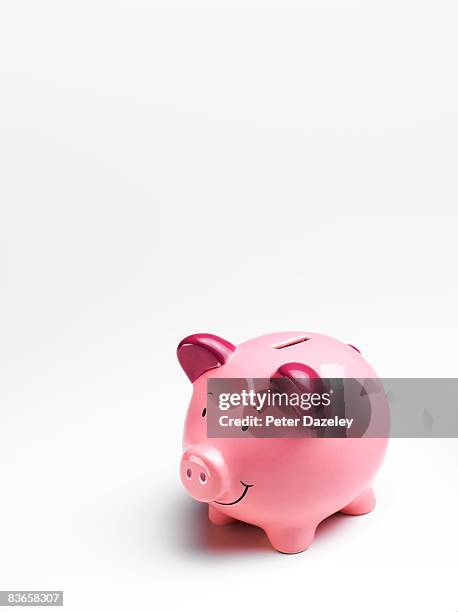 pink piggy bank on white background. - piggy bank stock pictures, royalty-free photos & images