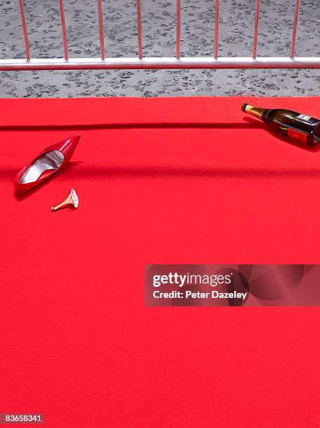 broken high heeled shoe on red carpet - day after party stock-fotos und bilder