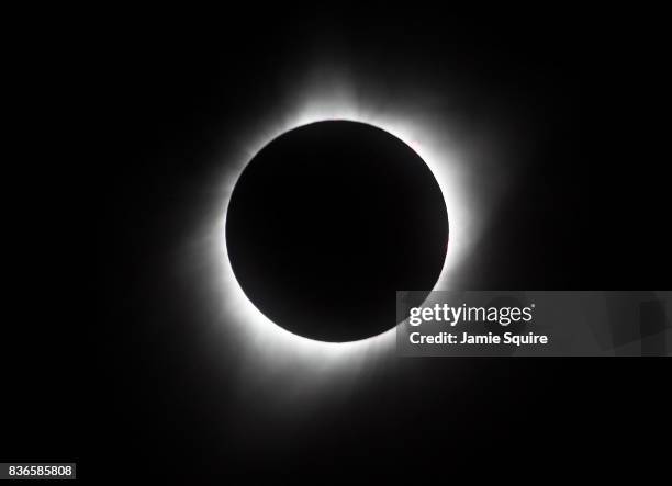 The sun is seen in full eclipse over a park on August 21, 2017 in Hiawatha, Kansas. Millions of people have flocked to areas of the U.S. That are in...