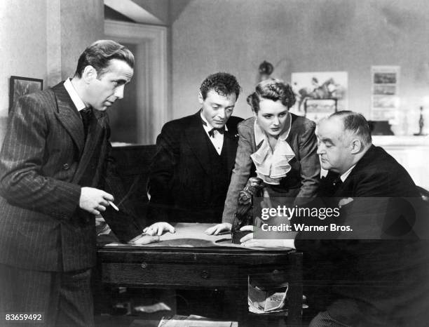 From left to right, actors Humphrey Bogart , Peter Lorre , Mary Astor and Sidney Greenstreet in a still from the film 'The Maltese Falcon', directed...