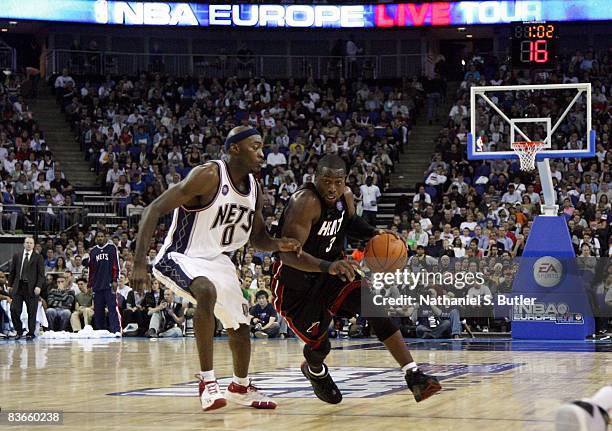 Dwyane Wade of the New Jersey Nets drives the ball up court against Julius Hodge of the Miami Heat during a preseason game in the 2008 NBA Europe...