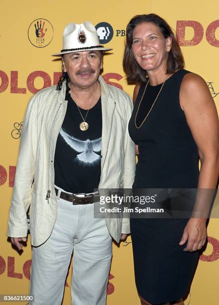 Producer/musician Carlos Santana and PBS distribution co-president Andrea Downing attend the "Dolores" New York premiere at The Metrograph on August...