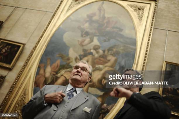 Prince Henrik of Denmark chats with the president of the Louvres Museum Henri Loyrette on November 12, 2008 in Paris, after he inaugurated the...