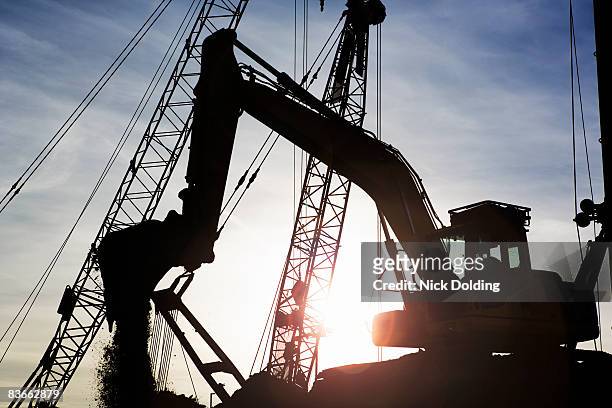 digger on building site - archaeology dig stock pictures, royalty-free photos & images