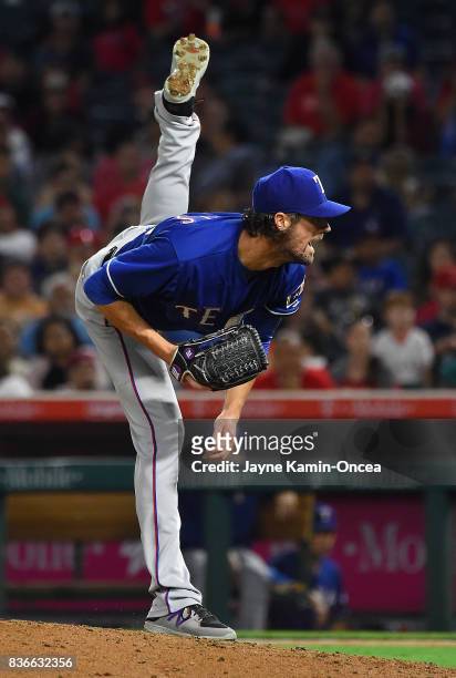 Cole Hamels of the Texas Rangers pitches in the sixth inning of the game against the Los Angeles Angels of Anaheim at Angel Stadium of Anaheim on...