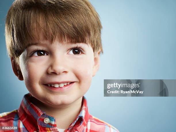 portrait of a smiling 3 year old boy.  - blonde boys stockfoto's en -beelden