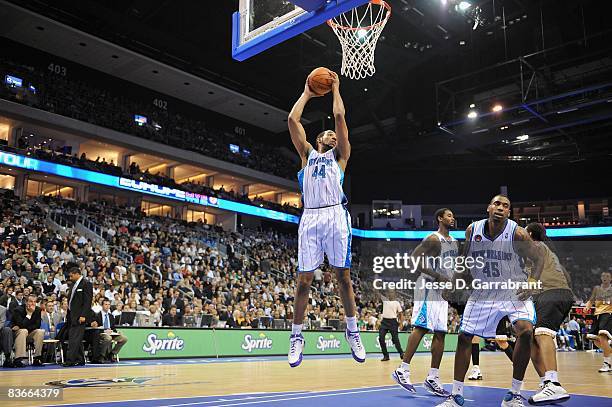 Courtney Sims of the New Orleans Hornets rebounds the ball during the game against the Washington Wizards at the 2008 NBA Europe Live Tour on October...