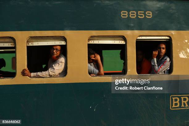 Passengers are seen on a local train on August 21, 2017 in Dhaka, Bangladesh.