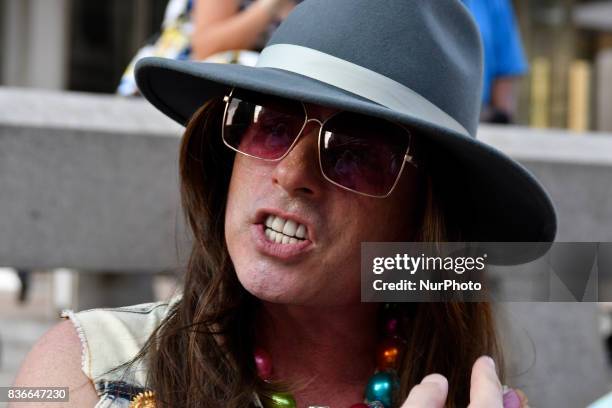 Activist Mike Hisey is seen in discussion with a bystander as protestors demand the removal of the Frank Rizzo statue, at a rally near City Hall, in...