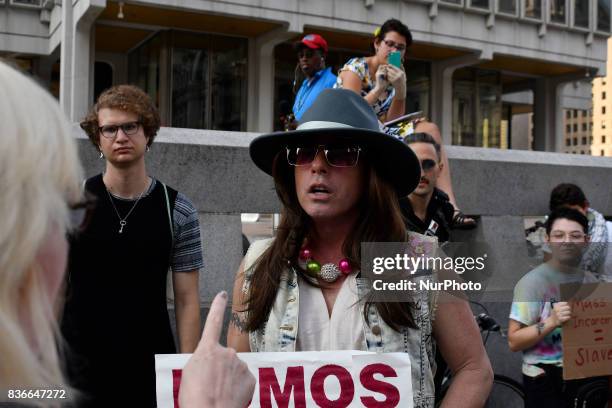 Activist Mike Hisey is seen in discussion with a bystander as protestors demand the removal of the Frank Rizzo statue, at a rally near City Hall, in...