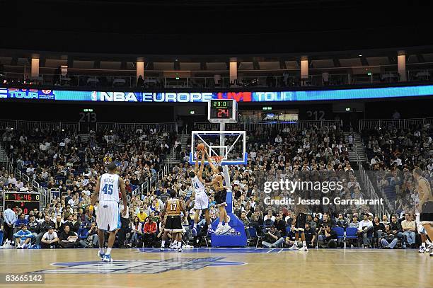 Courtney Sims of the New Orleans Hornets puts up a shot against Caron Butler of the Washington Wizards during the game at the 2008 NBA Europe Live...