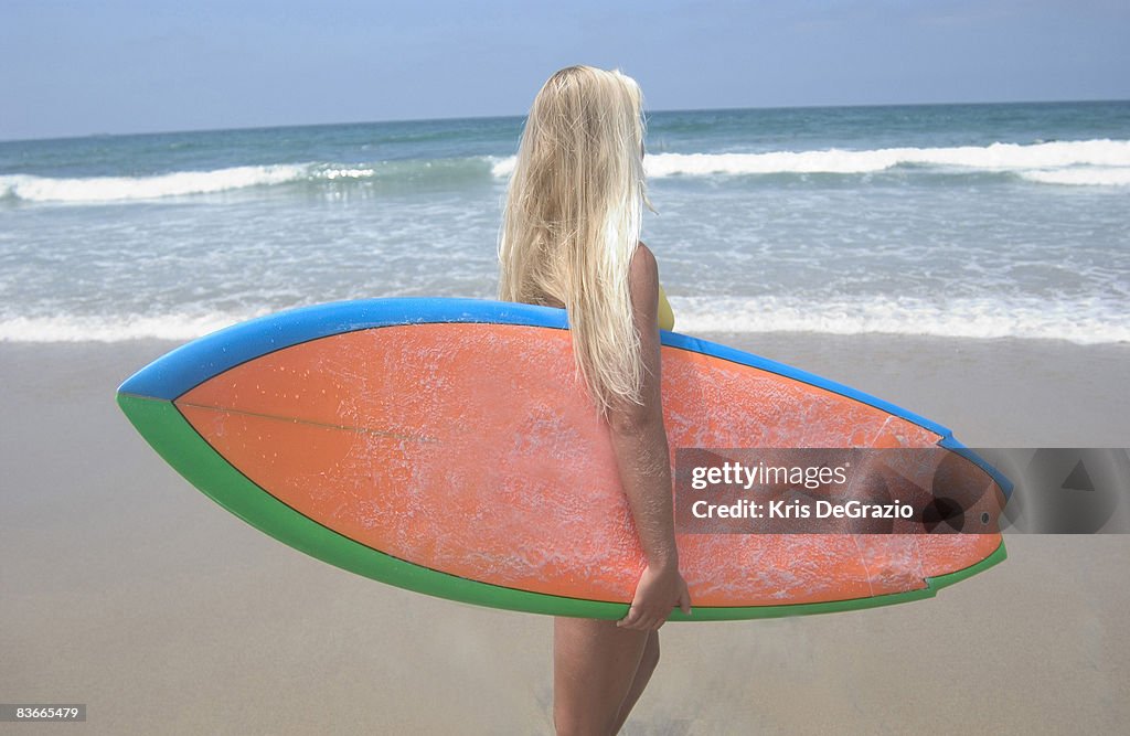 Surfer Girl looking at ocean