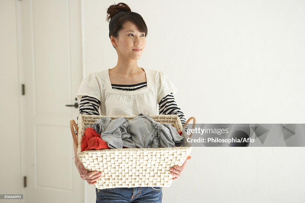 Woman carrying laundry basket