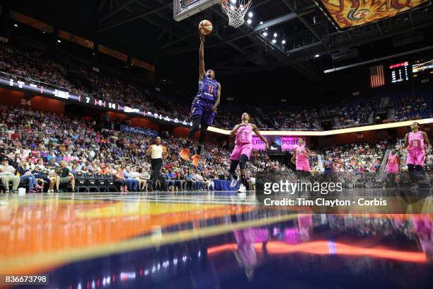 Danielle Robinson of the Phoenix Mercury drives to the basket defended by Jasmine Thomas of the Connecticut Sun during the Connecticut Sun Vs Phoenix...