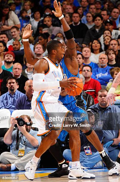 Desmond Mason of the Oklahoma City Thunder goes to the basket against Mickael Pietrus of the Orlando Magic at the Ford Center November 12, 2008 in...