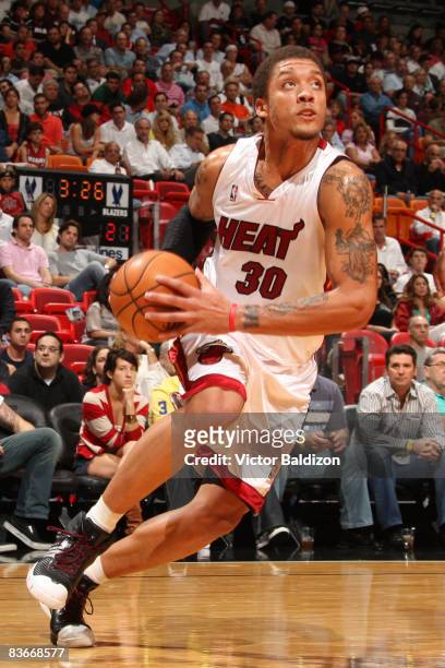 Michael Beasley of the Miami Heat drives against the Portland Trail Blazers on November 12, 2008 at the American Airlines Arena in Miami, Florida....