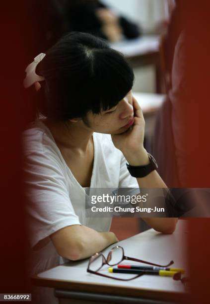 South Korean student takes her College Scholastic Ability Test at a school on November 13, 2008 in Seoul, South Korea. More than 580,000 high school...