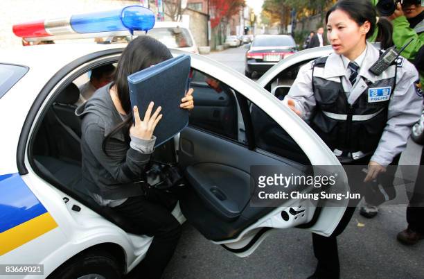 South Korean high school girl arrives at a school by police car to take the College Scholastic Ability Test on November 13, 2008 in Seoul, South...