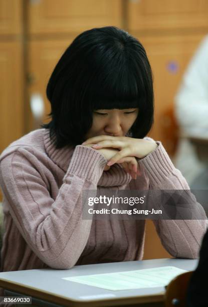 South Korean student takes her College Scholastic Ability Test at a school on November 13, 2008 in Seoul, South Korea. More than 580,000 high school...