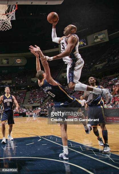 Vince Carter of the New Jersey Nets against Rasho Nesterovic of the Indiana Pacers during the game on November 12, 2008 at the Izod Center in East...