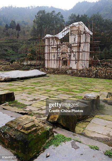 The Bailu Church destroyed in the Sichuan Earthquake is surrounded with scaffolding as preparation begins for reconstruction on November 12, 2008 in...