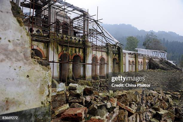 The Bailu Church destroyed in the Sichuan Earthquake is surrounded with scaffolding as preparation begins for reconstruction on November 12, 2008 in...