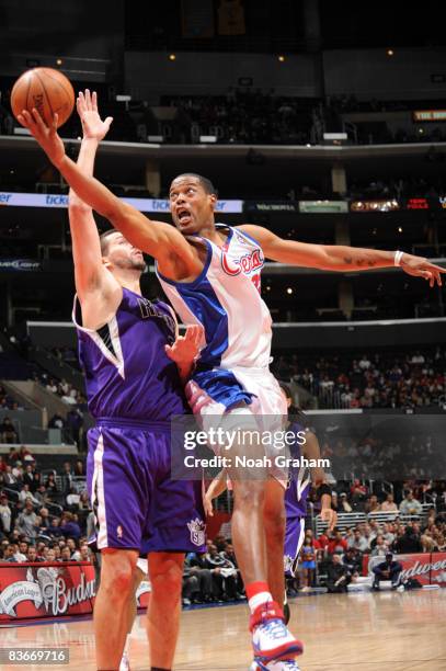 Marcus Camby of the Los Angeles Clippers puts up a shot against Brad Miller of the Sacramento Kings at Staples Center on November 12, 2008 in Los...