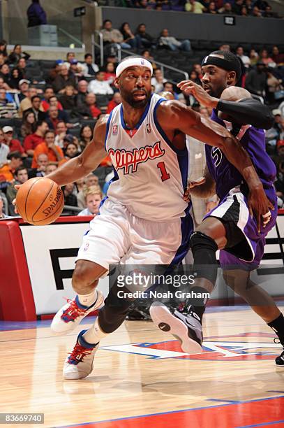 Baron Davis of the Los Angeles Clippers dribbles against Bobby Brown of the Sacramento Kings at Staples Center on November 12, 2008 in Los Angeles,...