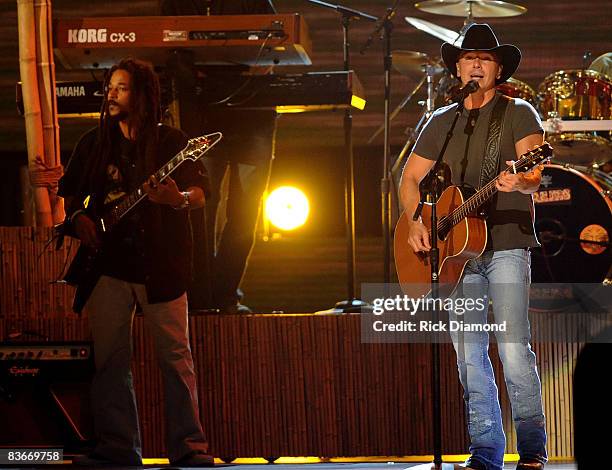 Musician Kenny Chesney performs "Everybody Wants to Go to Heaven" and "Three Little Birds" with the Wailers on stage during the 42nd Annual CMA...