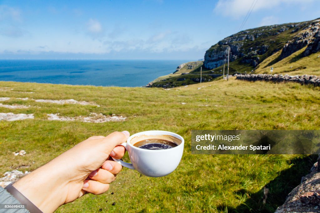 Drinking coffee from personal perspective and enjoying the view at Great Orme, Llandudno