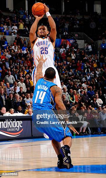 Earl Watson of the Oklahoma City Thunder shoots a jump shot against Jameer Nelson of the Orlando Magic at the Ford Center November 12, 2008 in...
