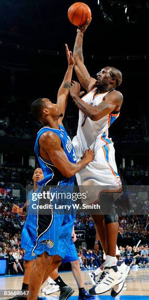 Joe Smith of the Oklahoma City Thunder shoots a jump shot against Rashard Lewis of the Orlando Magic at the Ford Center November 12, 2008 in Oklahoma...