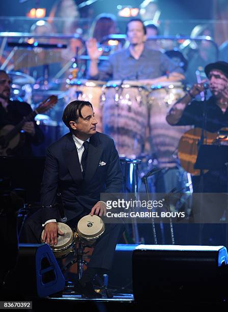 Actor Andy Garcia plays congas during the 2008 Latin Recording Academy Person of the Year awards tribute to Gloria Estefan held at the George R....