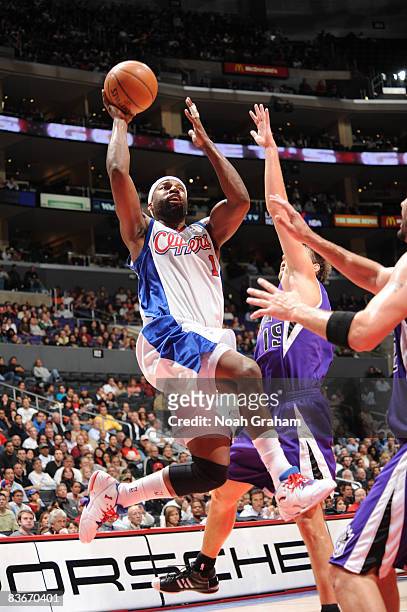 Baron Davis of the Los Angeles Clippers attempts a shot against the Sacramento Kings at Staples Center on November 12, 2008 in Los Angeles,...