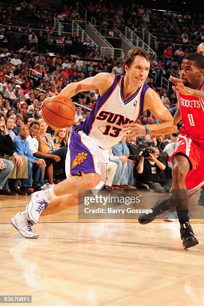 Steve Nash of the Phoenix Suns drives against Aaron Brooks of the Houston Rockets in an NBA game played on November 12 at U.S. Airway Center in...