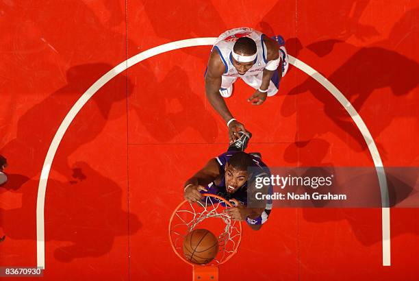 Jason Thompson of the Sacramento Kings dunks while Ricky Davis of the Los Angeles Clippers looks on at Staples Center on November 12, 2008 in Los...