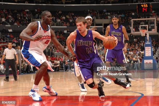 Beno Udrih of the Sacramento Kings handles the ball against Tim Thomas of the Los Angeles Clippers at Staples Center on November 12, 2008 in Los...