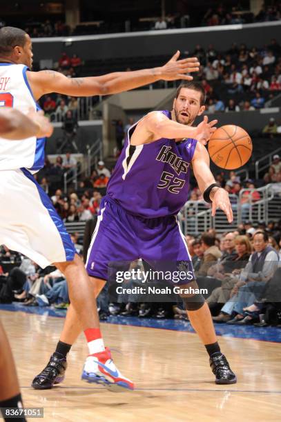 Brad Miller of the Sacramento Kings passes against Marcus Camby of the Los Angeles Clippers at Staples Center on November 12, 2008 in Los Angeles,...