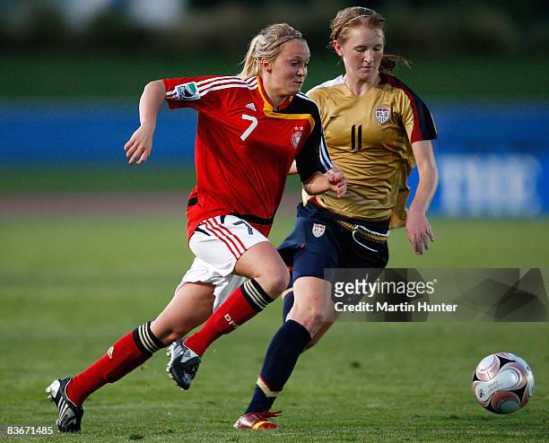 Turid Knaak of Germany battles with Sam Mewis during the FIFA U17 Women`s World Cup Semi Final match between Germany and the USA at QE II Stadium on...