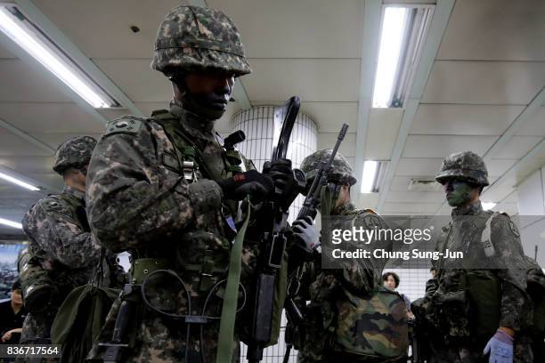 South Korean soldiers participate in an anti-terror and anti-chemical terror exercise as part of the 2017 Ulchi Freedom Guardian at subway station on...