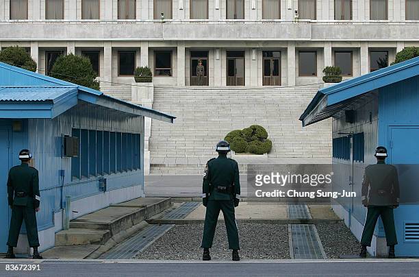 South Korean soldiers stand guard, near the South side of the border in the village of Panmunjom between South and North Korea in the demilitarized...