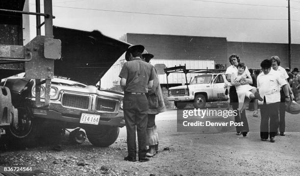 One Injured In Car-Train Crash Ambulance attendants carry Cindy Maka Caldwell, Idaho, from the scene after car in which she was riding was struck by...