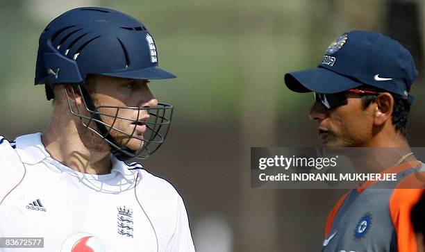 England cricketer Andrew Flintoff exchanges words with Indian cricket bowling coach Venkatesh Prasad during a training session ahead of the first One...