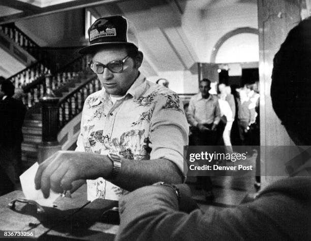 East H.S. RTD Union members voting on contract here we have a shot of Dana K. McCue a mechanic for RTD. Putting his vote into the box Credit: The...