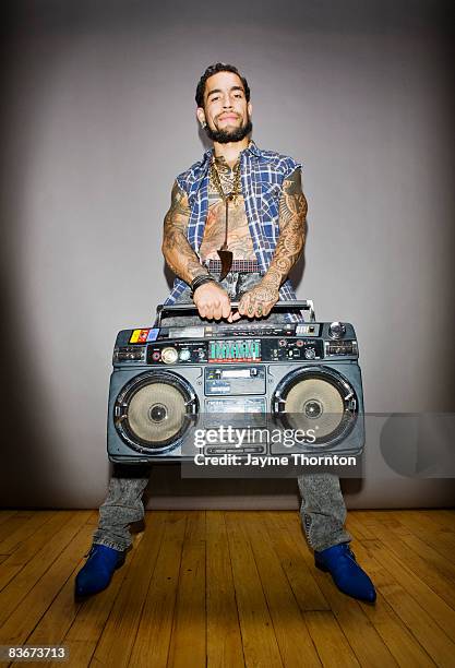 hipster man holding boombox  - boom box stock pictures, royalty-free photos & images