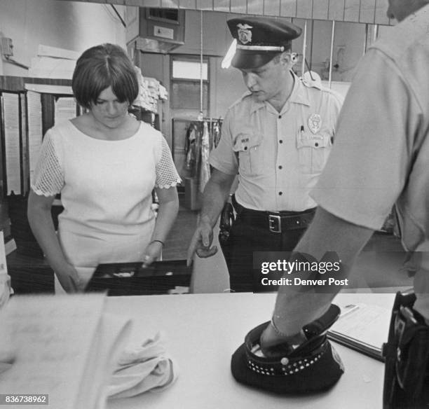 Bandit Took All Cash From Drawer Miss Joella Kayton of 1606 S. Stuart St., tells Sgt. C. D. Dressel how a bandit took $50 to $75 from cash drawer...