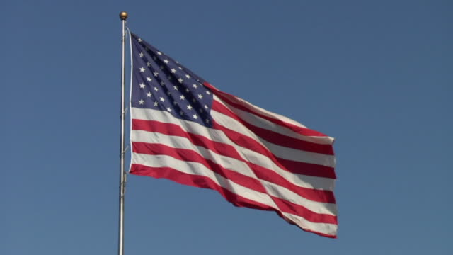 SLO MO, MS, American flag flapping in wind against blue sky, Billings, Montana, USA