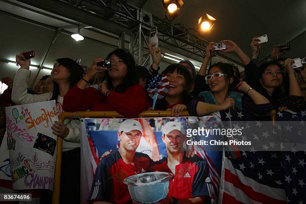 Fans of Bob Bryan and Mike Bryan of the United States cheer as brother Bryan perform after their round robin match against Jeff Coetzee of South...
