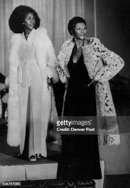 Sandy Brockman, left, and Alma G. Brown model gowns from Paraphernalia and furs from Duplers in fashion .how at "An Evening with the Stars," 2nd...
